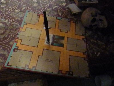 Picture of a Cluedo board with a knife through it